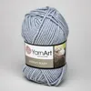 A ball of gray yarn with a label. Produktbild-Vorschau