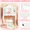 A white children's vanity table with a stool and accessories, set against a pink background with illustrative elements. Anteprima dell’immagine prodotto