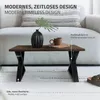 A coffee table with a vase and a mug on it, placed on a rug in front of a sofa. Podgląd zdjęcia produktu