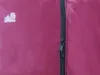 A close-up of a zipper on a purple fabric. Podgląd zdjęcia produktu