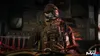 A soldier in tactical gear, wearing a skull mask, sits in what appears to be a vehicle. Produktbild-Vorschau