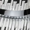 A close-up view of a chrome and crystal chandelier. Produktbild-Vorschau