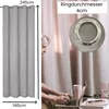 A person is working on a laptop in front of a light gray curtain. A close-up of a curtain ring is shown. Produktbild-Vorschau