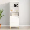 A white highboard with wooden legs is shown against a light gray wall. Náhľad obrázku produktu