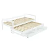 A white daybed with a pull-out trundle and drawers, shown from a slightly elevated side angle against a white background. Produktbild-Vorschau