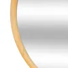 A close-up view of the edge of a round mirror with a wooden frame. Voir les images du produit