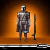 A Star Wars Vintage Collection The Mandalorian Beskar action figure with accessories, presented against a gradient background. Produktbild-Vorschau