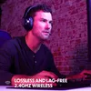 A man wearing headphones is playing a video game. Produktbild-Vorschau