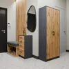 A hallway with a storage unit, bench, and mirror. Produktbild-Vorschau