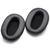 Two black ear pads for headphones are shown on a white background. Náhled obrázku produktu