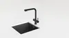 A black kitchen faucet and sink are shown on a white countertop. Podgląd zdjęcia produktu