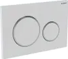 A white flush plate with two circular buttons, one larger than the other, both with silver trim. The Geberit logo is visible in the top right corner. Produktbild-Vorschau