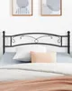 A black metal headboard is shown above a bed with white and peach pillows and bedding. Podgląd zdjęcia produktu