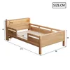 A wooden bed with dimensions shown. Voir les images du produit