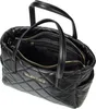 A black quilted Valentino handbag with gold hardware is shown from a slightly elevated angle, with the top open to reveal the interior. Náhľad obrázku produktu