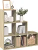 A modular bookshelf filled with decorative items and books. Anteprima dell’immagine prodotto