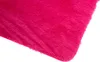 A close-up view of a pink, fluffy rug. Produktbild-Vorschau