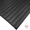 A close-up, angled view of black textured panels. Náhled obrázku produktu