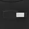 A close-up of a black luggage tag attached to a black suitcase. Voir les images du produit