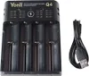 A black universal battery charger with four slots and a USB charging cable, shown on a white background. Produktbild-Vorschau