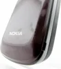 A close-up shot of the corner of a red Nokia flip phone. Produktbild-Vorschau