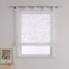 A white sheer Roman blind with a floral pattern is shown hanging in a window. Produktbild-Vorschau