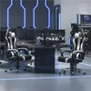 A modern gaming room with multiple computer setups and neon blue lighting. Produktbild-Vorschau