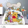 A child's bedroom with a Winnie the Pooh themed bed set. Produktbild-Vorschau