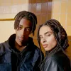 Two young people wearing headphones in front of a tiled wall. Voir les images du produit