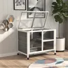 A pet cage is shown in a room with shelves and a plant. Náhled obrázku produktu