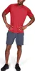 A man wearing a red t-shirt and gray shorts, posing with hands on hips. Náhľad obrázku produktu