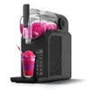 A black slush maker with pink slush inside and a glass of pink and purple slush in front of it. Produktbild-Vorschau