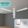 A disassembled white ceiling fan is shown against a gray wall and white ceiling, with an inset showing a remote control holder. Náhled obrázku produktu