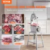 A commercial bone cutting machine is shown in a kitchen setting, with various types of meat and fish displayed around it. Produktbild-Vorschau
