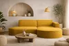 A modern living room with a yellow sectional sofa, coffee table, and floor lamp. Produktbild-Vorschau