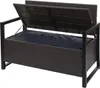 A brown rattan storage bench with the lid open, revealing a dark blue cushion inside. The bench has a black metal frame. Voir les images du produit