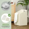A laundry basket with a towel draped over it, next to a wooden shelf unit with towels and a plant. Podgląd zdjęcia produktu