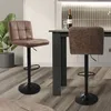 A kitchen or dining area with bar stools and a counter. Produktbild-Vorschau
