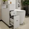 A white bathroom cabinet with drawers next to a toilet. Náhľad obrázku produktu