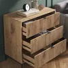 A wooden dresser with three drawers is shown in a room. Produktbild-Vorschau
