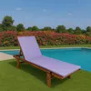 A purple chaise lounge cushion on a wooden lounge chair next to a swimming pool with a colorful flower hedge in the background. Anteprima dell’immagine prodotto