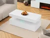 A modern white coffee table with LED lighting in a living room setting. Produktbild-Vorschau