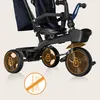 Close-up view of a child's tricycle, highlighting its wheels and frame. Podgląd zdjęcia produktu