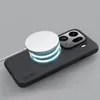 A black phone case with a white magnetic charger attached to it. Produktbild-Vorschau