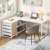 A corner desk setup in a room with a window and a bed. Anteprima dell’immagine prodotto