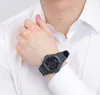 A person wearing a white shirt and a black digital watch. Produktbild-Vorschau