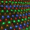 A net of colorful LED lights is spread out on a grassy surface. Náhled obrázku produktu