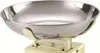 A close-up studio shot of a kitchen scale with a silver bowl on a cream-colored base. Náhled obrázku produktu