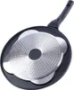 The underside of a frying pan with a textured metal insert and a black handle. Náhled obrázku produktu
