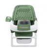 A green and white foldable bathtub for adults. Produktbild-Vorschau